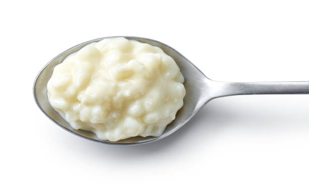 istock spoon of rice and milk pudding 1395223974