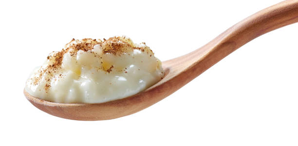 istock rice milk pudding in a wooden spoon 1395223981