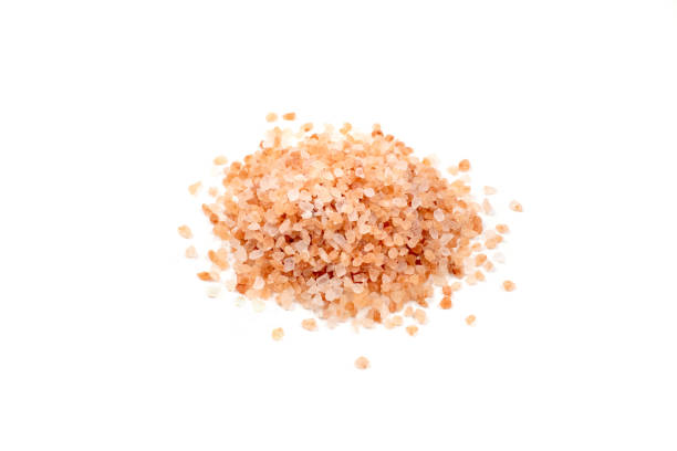 istock Pink salt crystals on white 1395230919