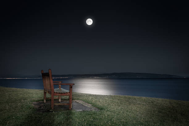 Bench in the moonlight at troon, scotland.