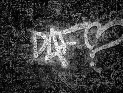 Black and white grainy graffiti wall