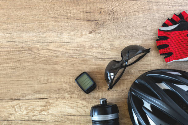 Bicycle accessories on a brown textured background in the corner