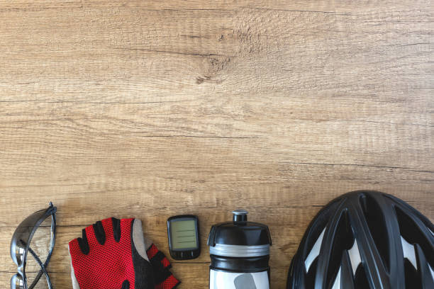 istock Bicycle accessories on a brown wooden background in a row 1395242184