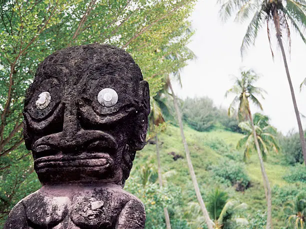 Tahiti statue on a mountain hillside on the island of Moorea.