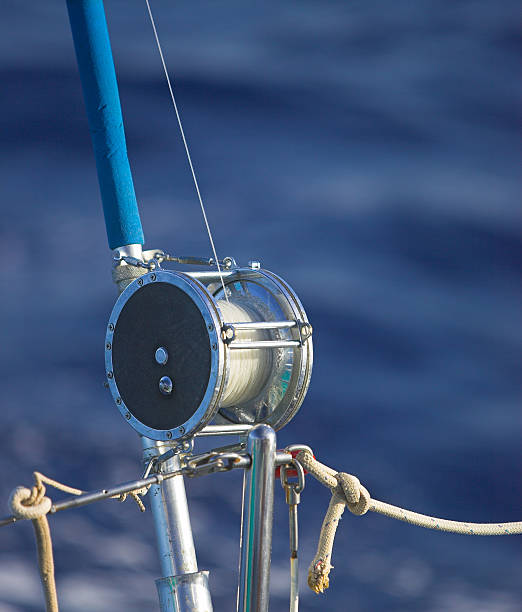 Rigged Fishing Reel At Sea stock photo