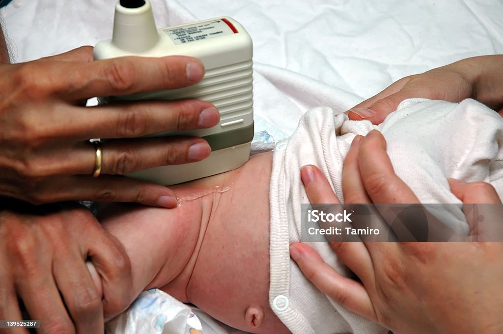 Ultrasound examination of a baby´s hip precautionary checkup of a baby by ultrasound Ultrasound Stock Photo