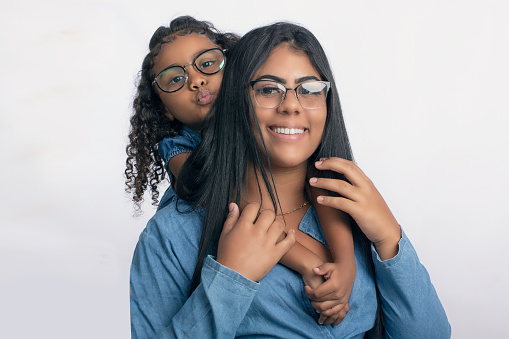mother and daughter with glasses in studio photo on white background for cropping