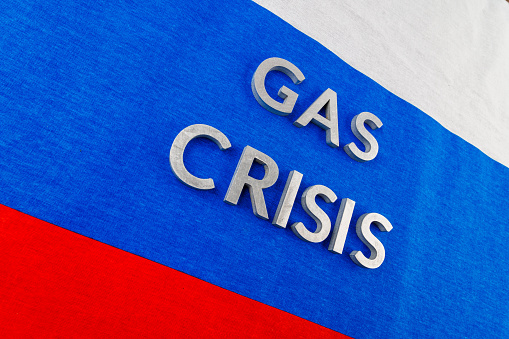the words gas crisis laid with silver letters over flat full-frame russian flag surface