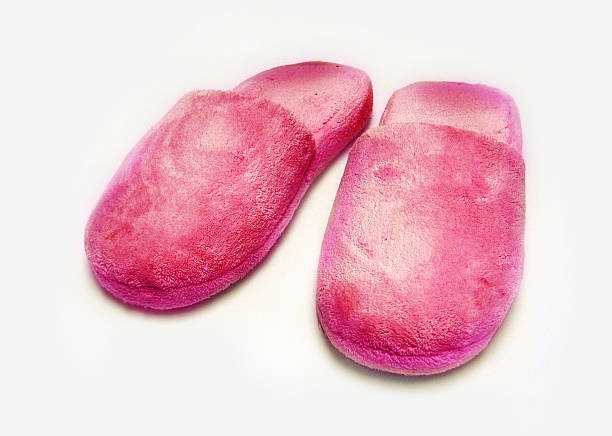 pair of pink fluffy slippers stock photo
