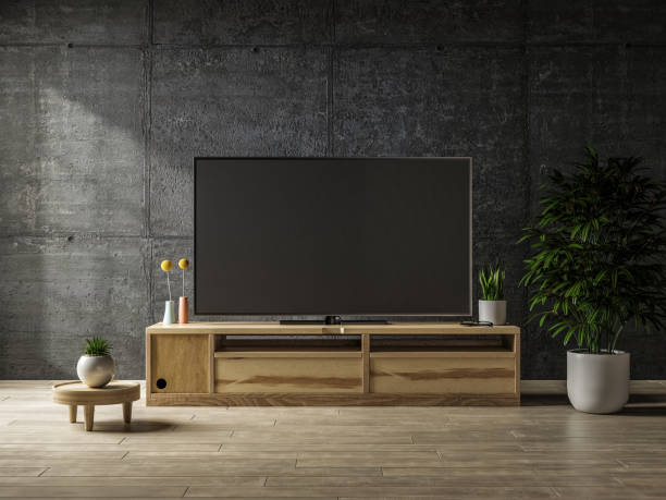 istock Cabinet with tv in interior concrete room mock up. 1395257519