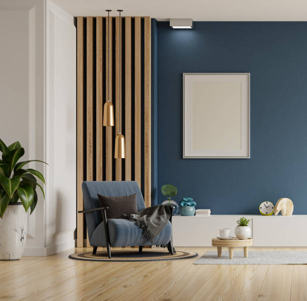 istock Poster mockup with vertical frames on empty dark blue wall in living room interior with blue velvet armchair. 1395257570