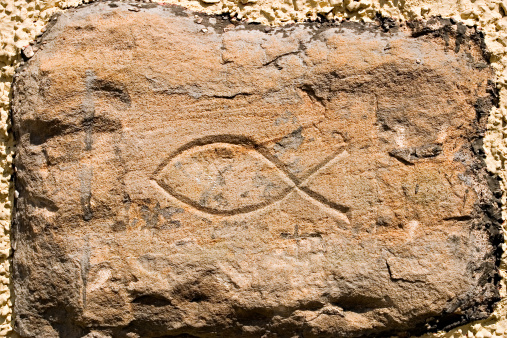 An ancient symbol of Christianity carved on the wall of the cave used as a chapel by the seventh century St. Fillan in Pittenweem, Fife, Scotland