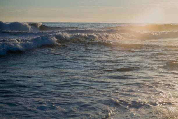 istock the sunset in the beach with the beautiful ocean 1395262703