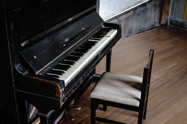 istock Old piano on abandoned Japanese elementary school 1395263847