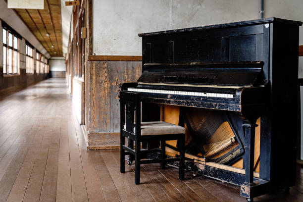 istock Old piano on abandoned Japanese elementary school 1395264353