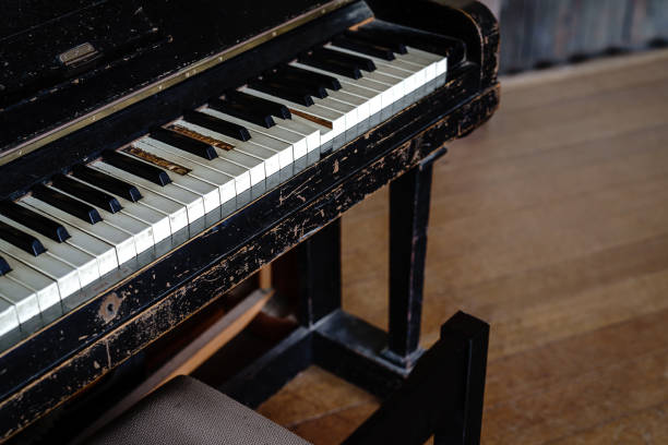istock Old piano on abandoned Japanese elementary school 1395264361