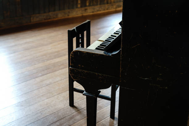 Vintage grand piano in the baroque style room.