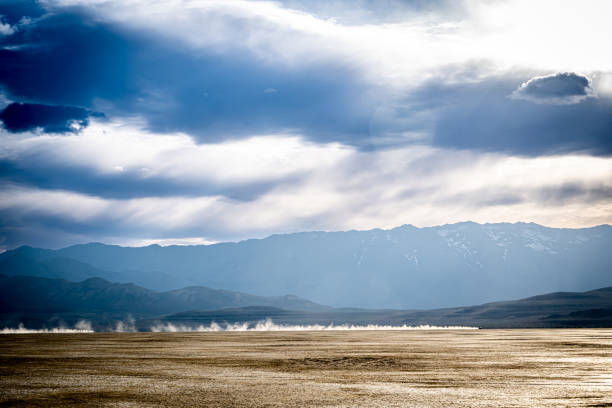 Pickup truck driving fast through Black Rock Desert.
