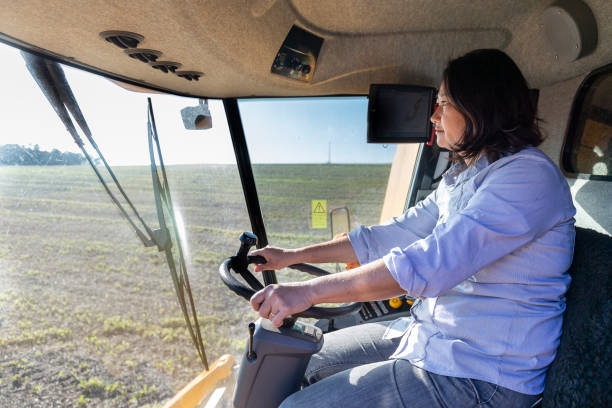 istock Woman operating agricultural machinery 1395264633
