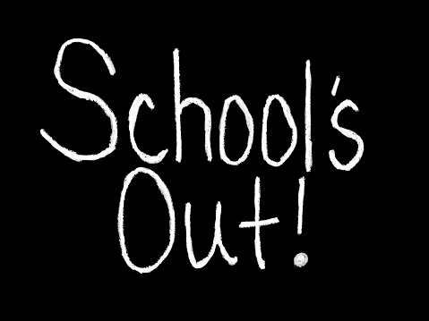 “School’s Out” handwritten with digital chalk with a black background. The end of a school term. A message affirming school is out of session.