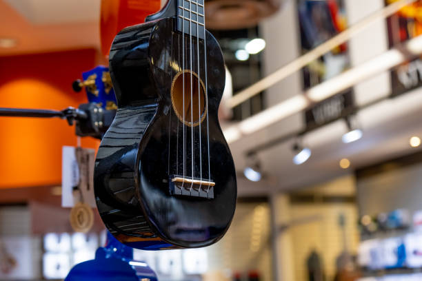 istock Guitars on display in music instruments store in a mall 1395266139