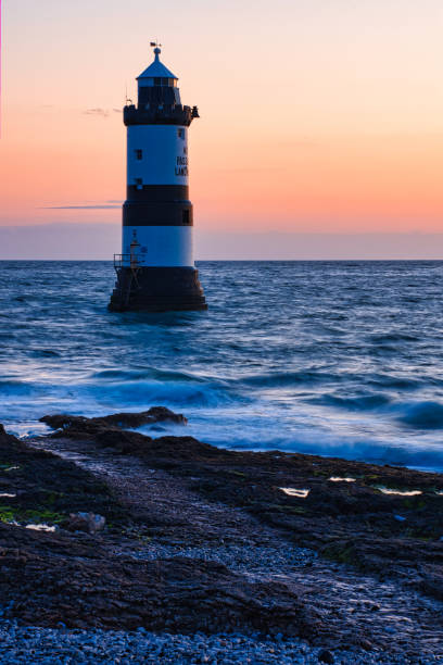 istock Penmon Point lighthouse at low tide, Penmon, Anglesey, Wales, Britain 1395269955