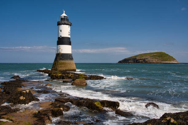 istock Penmon Point lighthouse and Puffin Island, Penmon, Anglesey, Wales, Britain 1395269998