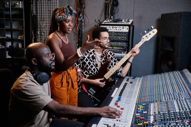 istock Musicians And Producer Working On Track 1395270377