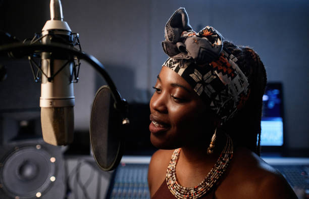 istock Black Singer Recording Song 1395270379