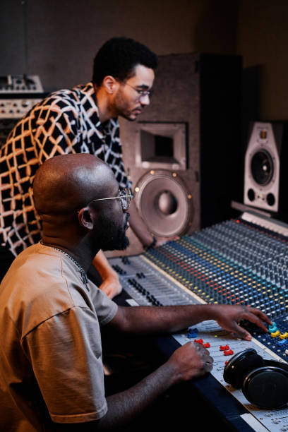 istock Producer And Musician In Studio 1395271096