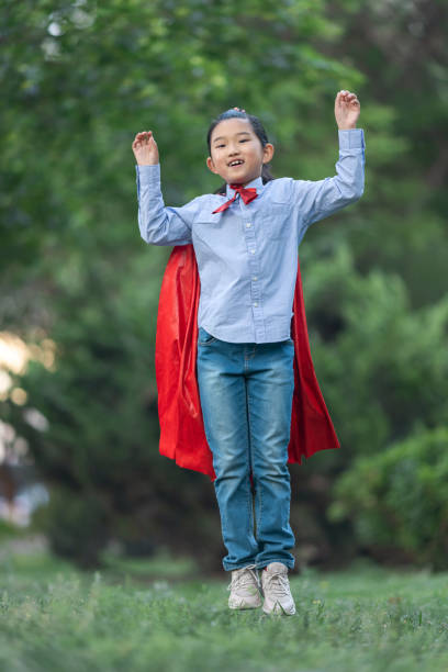istock Supergirl Flying 1395271287
