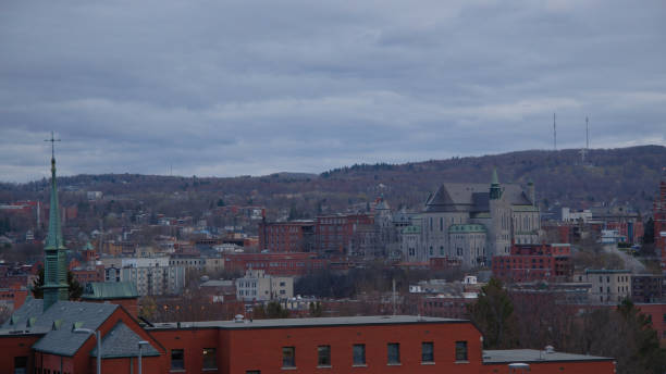 Sherbrooke small city in Quebec Estrie Eastern Townships cityscape downtown with church Small city landscape Sherbrooke Estrie Quebec Eastern Townships Canada downtown cathedral church clouds skyline sherbrooke quebec stock pictures, royalty-free photos & images