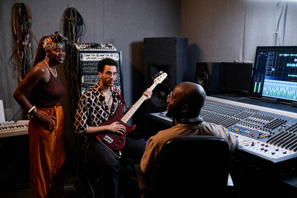 istock Group of Musicians Working In Recording Studio 1395271974