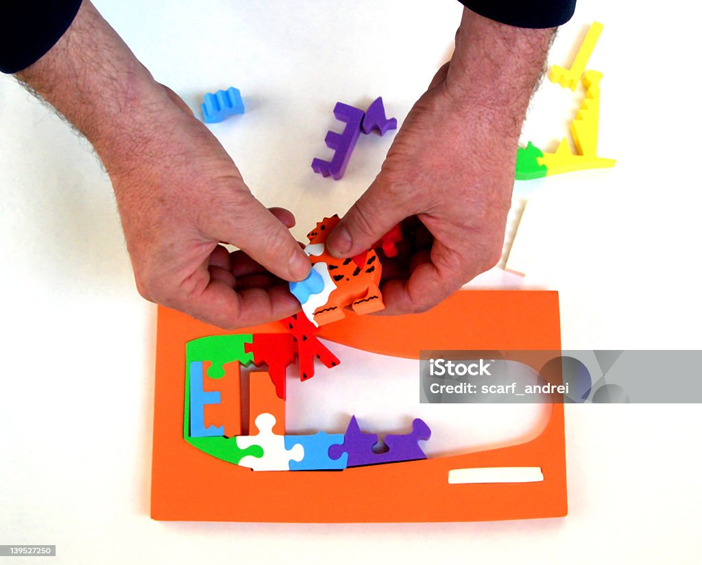 puzzel A man who try to make a puzzel. Beauty In Nature Stock Photo