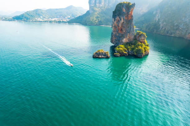 istock Sea views and rocky islands with a long-tail boat. 1395273054