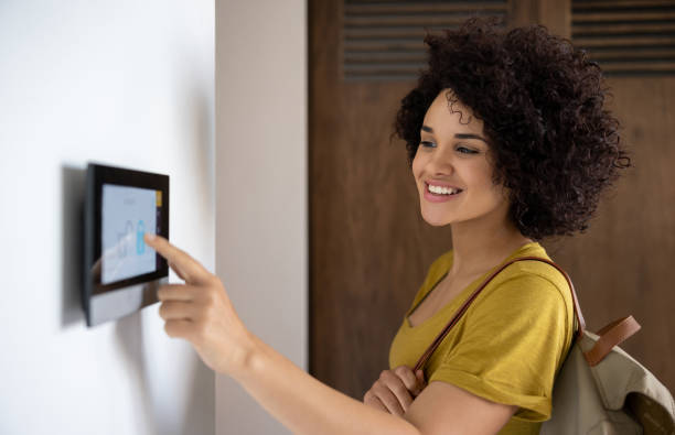 istock Woman activating the alarm while leaving her home 1395273154