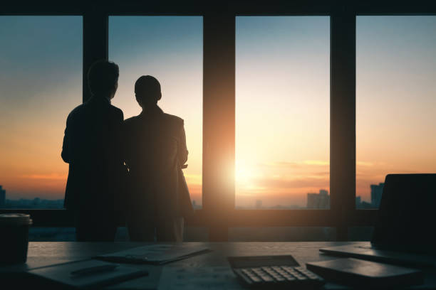 istock Man and woman are working in office 1395276761