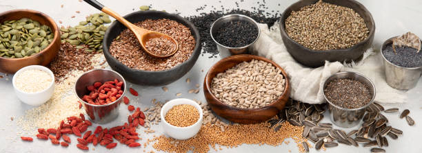 istock Variety of edible seeds on light background. 1395278550