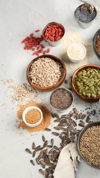 istock Variety of edible seeds on light background. 1395278584
