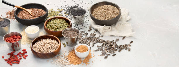 istock Variety of edible seeds on light background. 1395278595