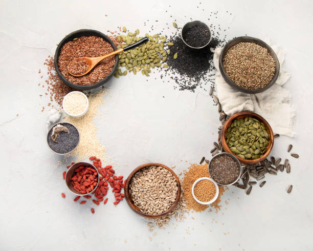 istock Variety of edible seeds on light background. 1395278601
