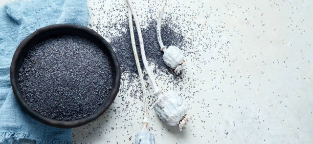 istock Composition with poppy seeds on gray background. 1395278779