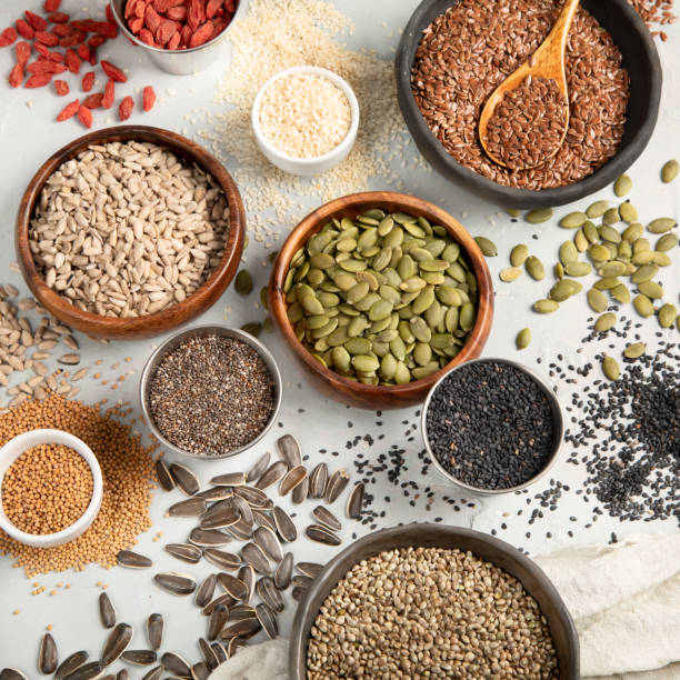istock Variety of edible seeds on light background. 1395278808