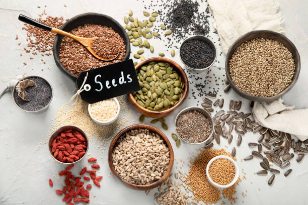istock Variety of edible seeds on light background. 1395278869
