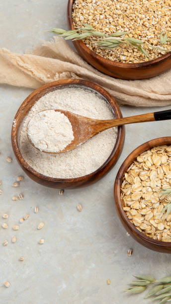 istock Dry oatmeal in bowl on light background. 1395279498