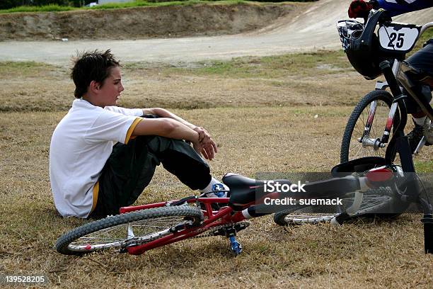 Boy Sitting Next To Bmx Bike Stock Photo - Download Image Now - BMX Cycling, Bicycle, Child