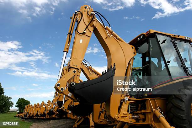 Construction Machinery Stock Photo - Download Image Now - Backhoe, In A Row, Blue