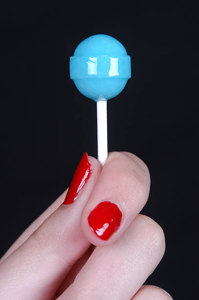 blue lollipop woman holding blue lollipop dum dum LOLIPOPS stock pictures, royalty-free photos & images