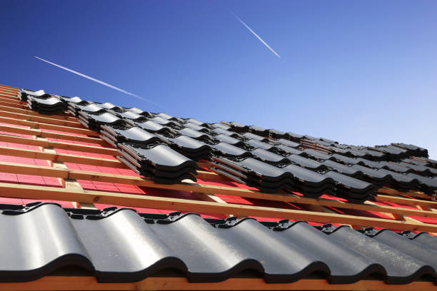 istock Roofing work, new covering of a tiled roof 1395287515