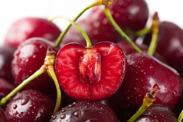 Photo of Close up of pile of ripe cherries background